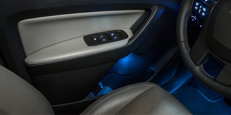 Rear window slightly open with a person fishing nearby