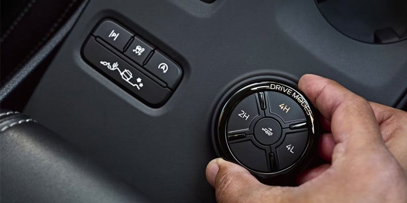 Close-up of the terrain management system dial with various off-road modes