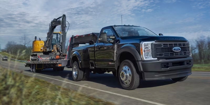 Rear view of the Super Duty with the tailgate down, loading a mountain bike