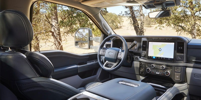Ford Super Duty cabin featuring steering wheel and infotainment screen
